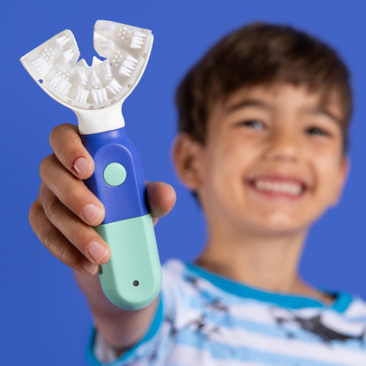 junior holding symplbrush